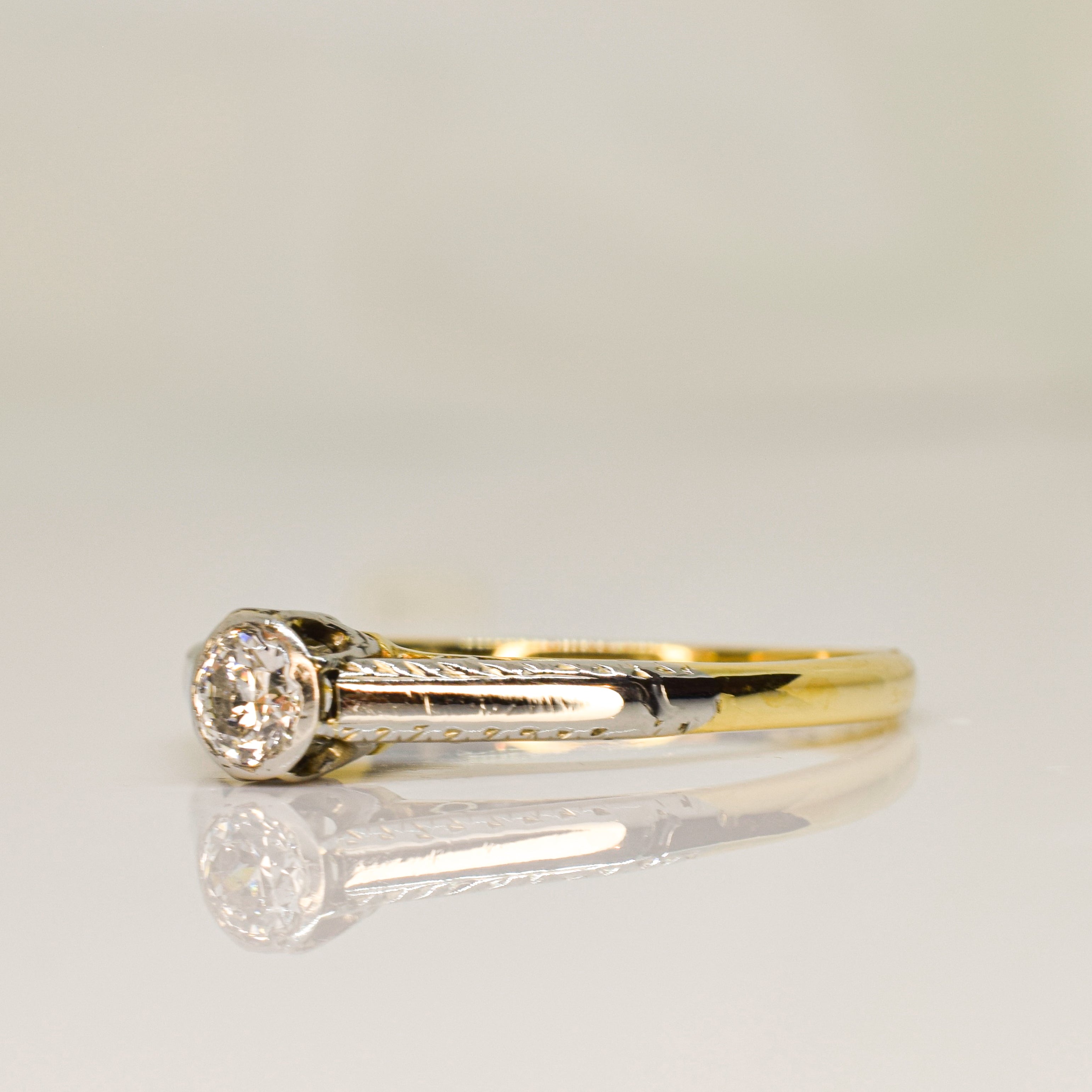 Antique platinum and 18ktt gold solitaire diamond ring 