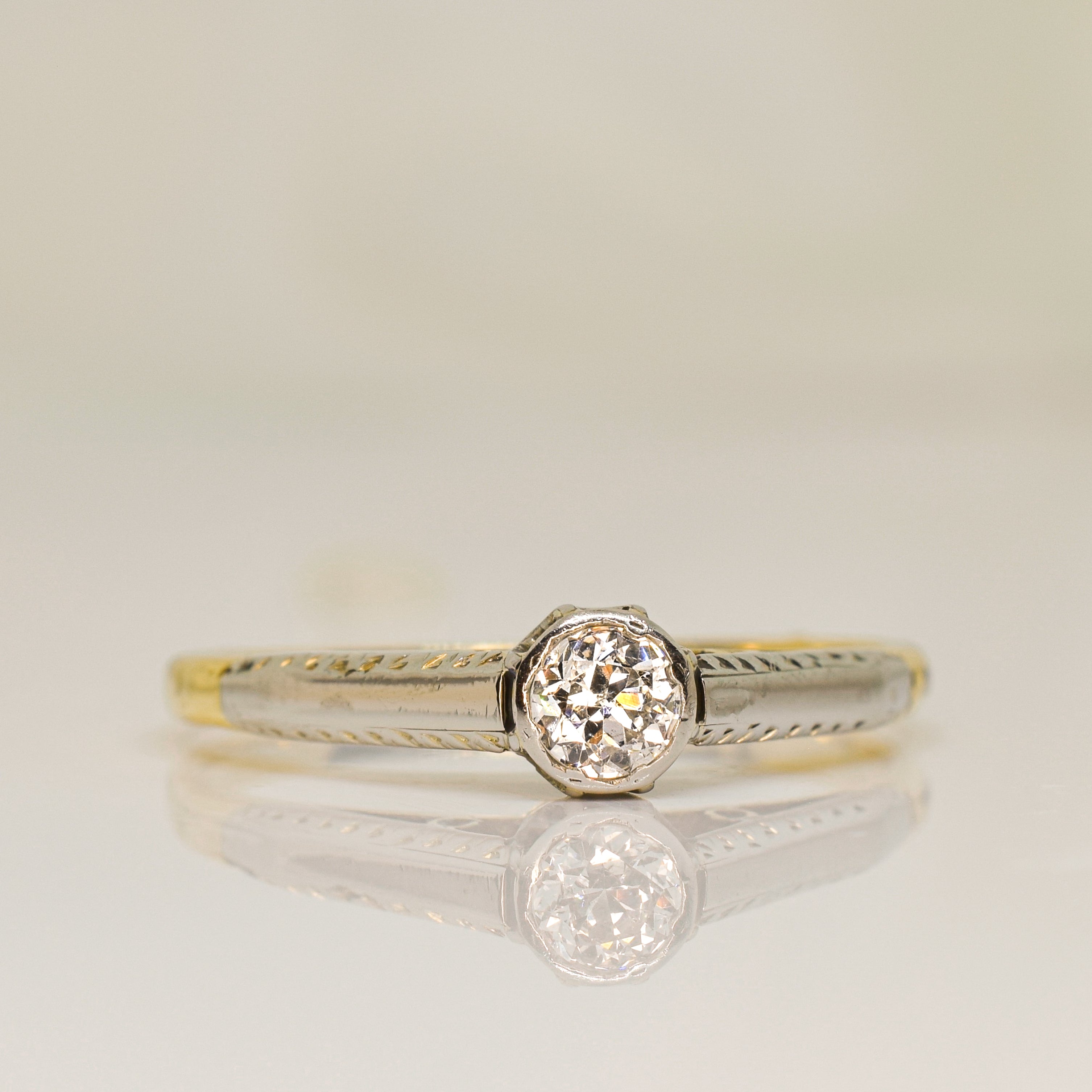 Antique platinum and 18ktt gold solitaire diamond ring